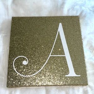 A initial/ symbol gold sparkle sign
